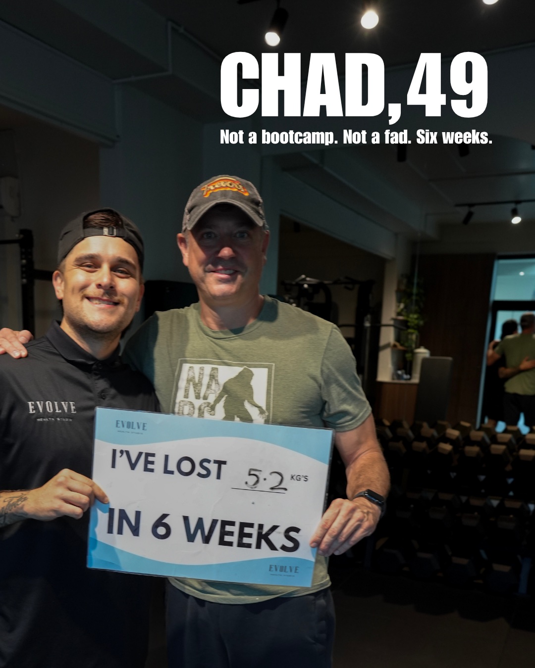 Chad holding a sign showing 5.2 kg lost